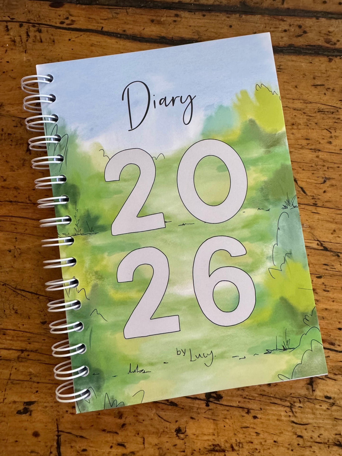 A6 wire bound week to view 2026 diary, featuring lots of characterful illustrations