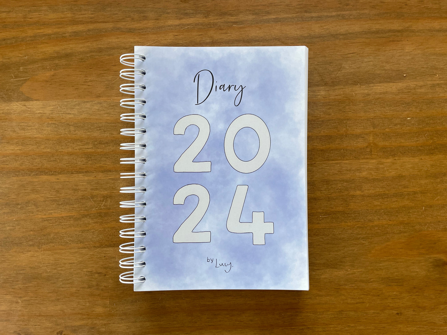 A5 wire bound week to view 2024 diary, featuring lots of characterful illustrations