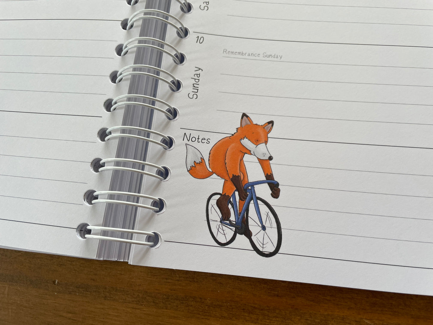 A5 wire bound week to view 2024 diary, featuring lots of characterful illustrations